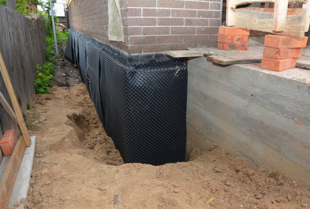 Happy homeowners after waterproofing job in State Line